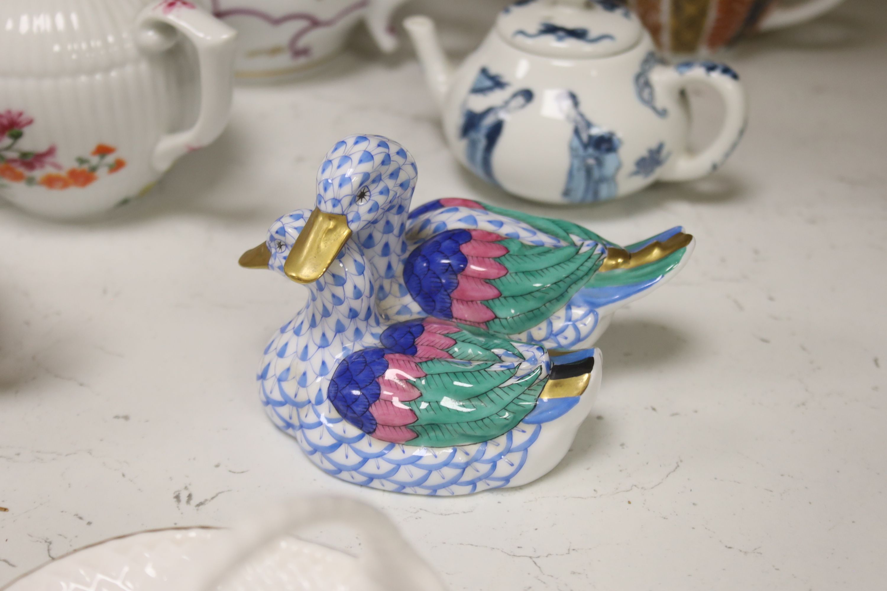Twelve modern floral-decorated collectors' teapots (V&A Museum Collection), a Spode dish, a table lamp and a Herend duck group (15)